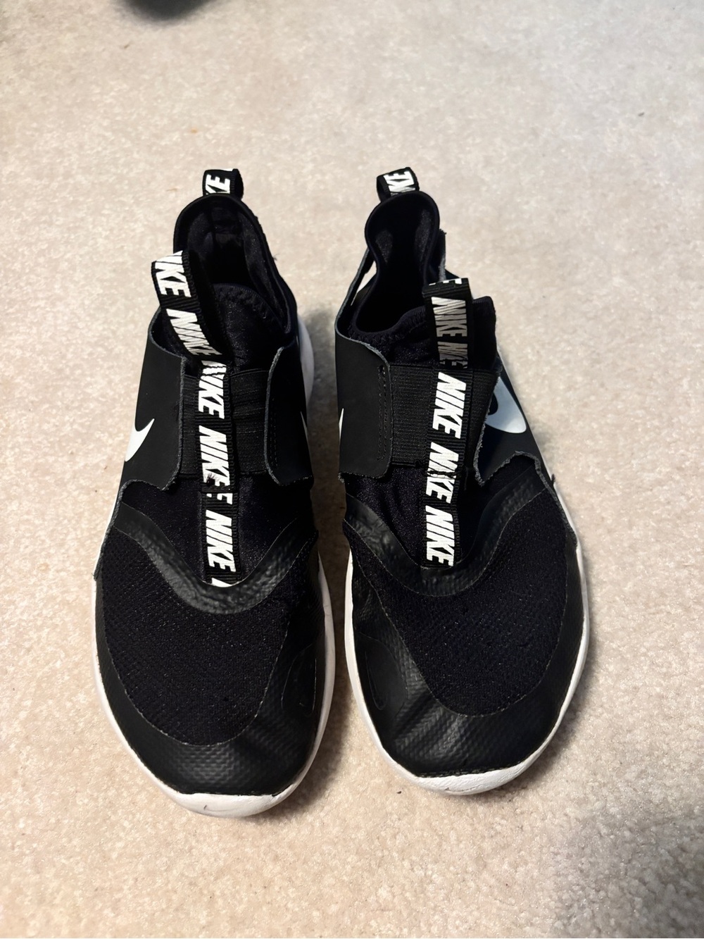 Nike Kids Black and White Slip-On Sneakers with Branded Pull Tabs